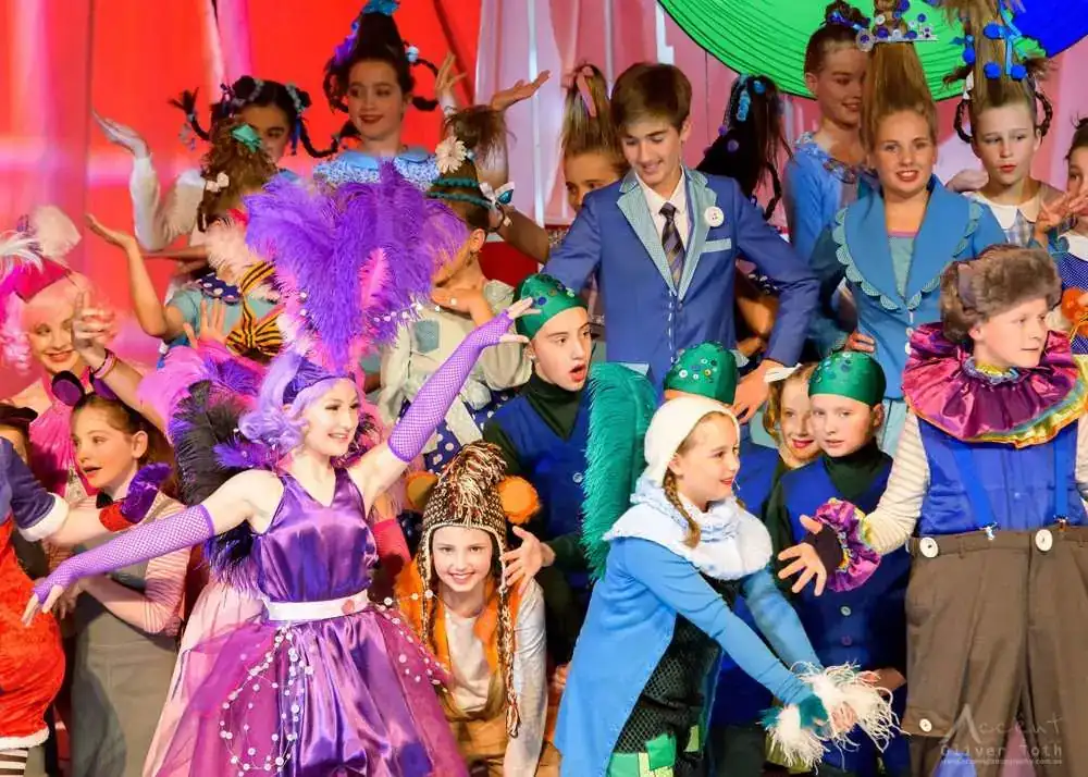 A colourful crowd of young performers