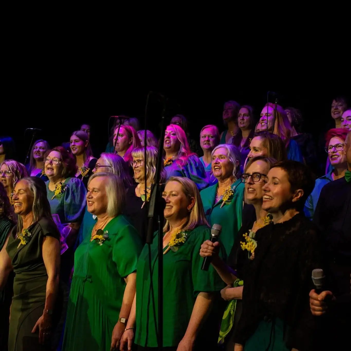Sing!OZ members singing on stage